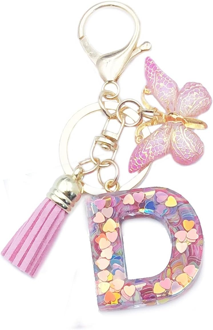 Keychain with letter 'D' charm, tassel, and butterfly
